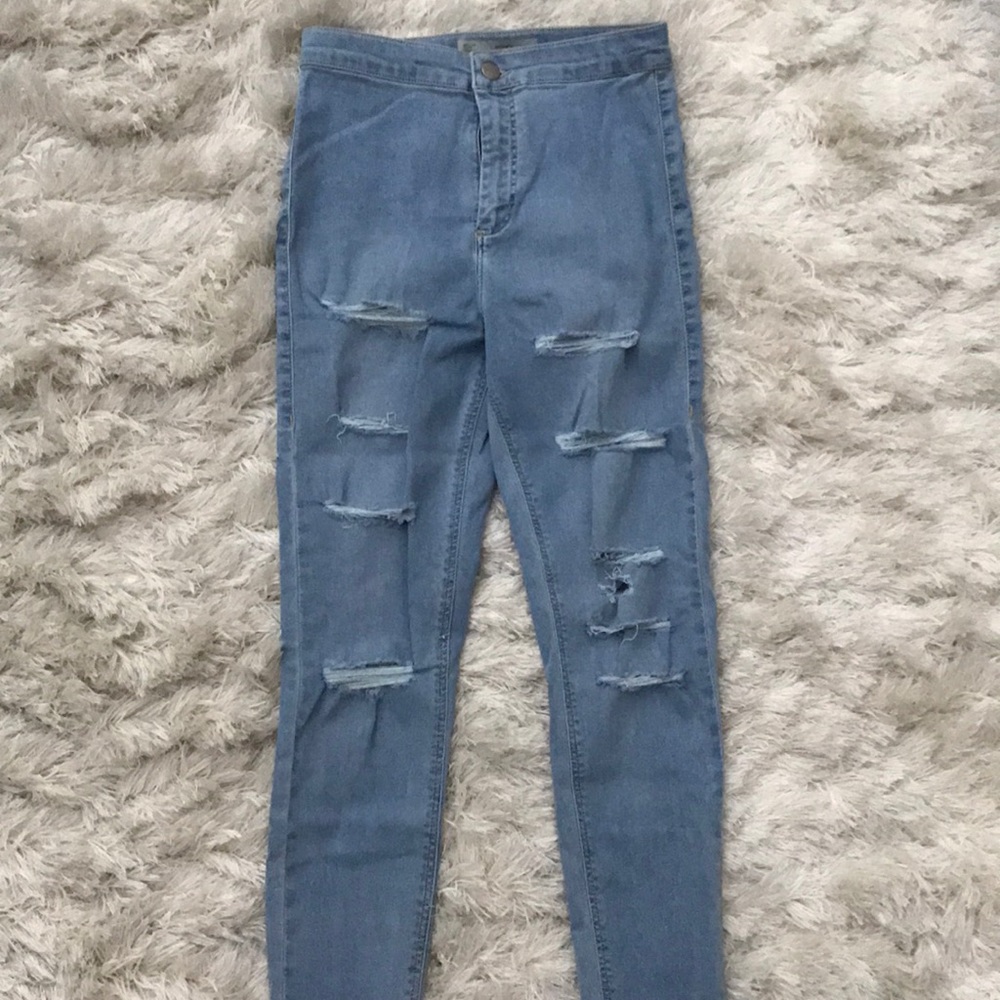 High waisted light wash denim jeans. Joni fit